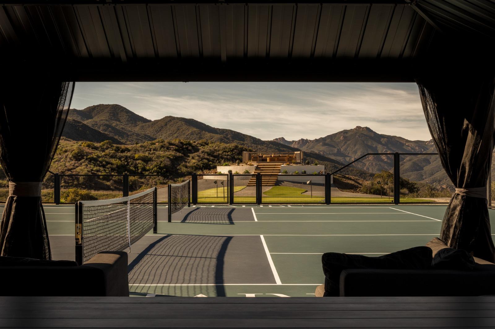 Thrive Malibu — Courts framed from the courtside pavilion